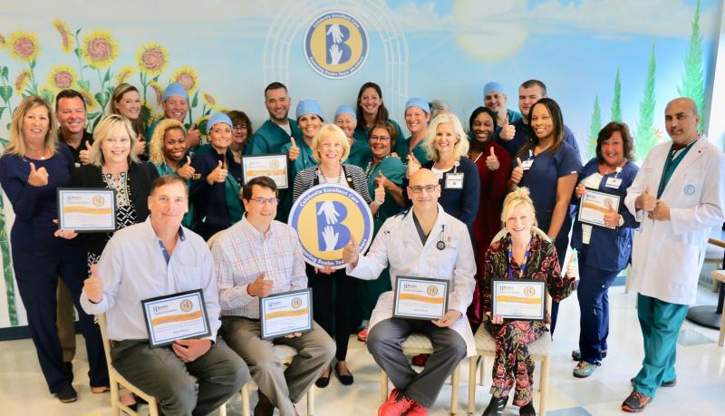 Judy Aliquo, front row center, celebrates the excellent care she received at Beebe with special certificates and thanks to her colleagues. Shown are in back (l-r) Michele Seiler, Sol Oxman, Katie Halen, Shannon Shelby, Tracey McCovr, Josh Roper, Ann Marie Fleming, Dana Schwartz, Brandon Hogan, Ravin Davidson, Kelly Devine, Krista Schoener, Tammy Kelly, Diane Steinbach, Sherry Phillips, Sue Ann Newsham, Tonya Jones, Kyle Schlezes, Chris Miller, Tiffany Wilson, Sandra Pistons and Dr. Ehtasham Qureshi.
In front are Dr. Paul Cowan, Dr. Kevin Bristowe, Dr. Mouhanad Freih, and Mary Frances Suter.